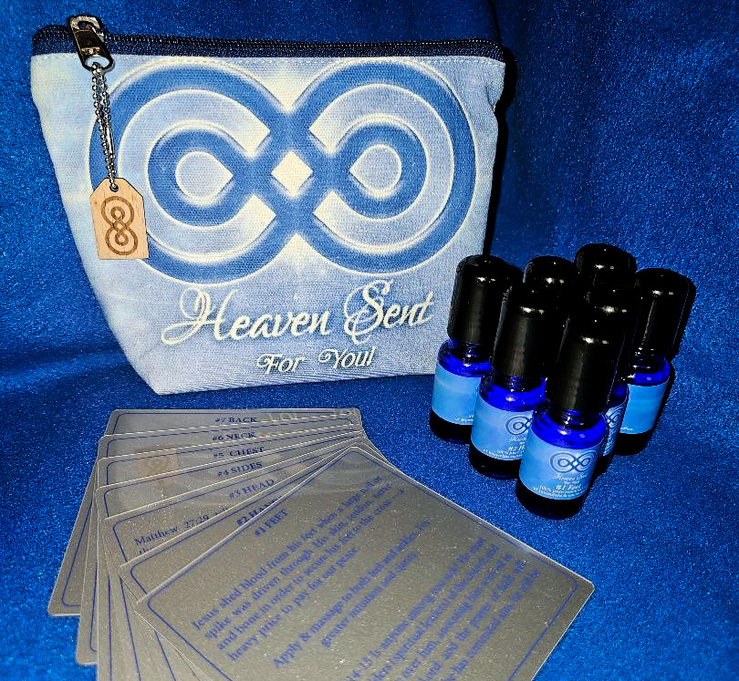 A blue-themed wellness kit featuring essential oil bottles, a pouch with an infinity symbol, and several organic cotton pads.